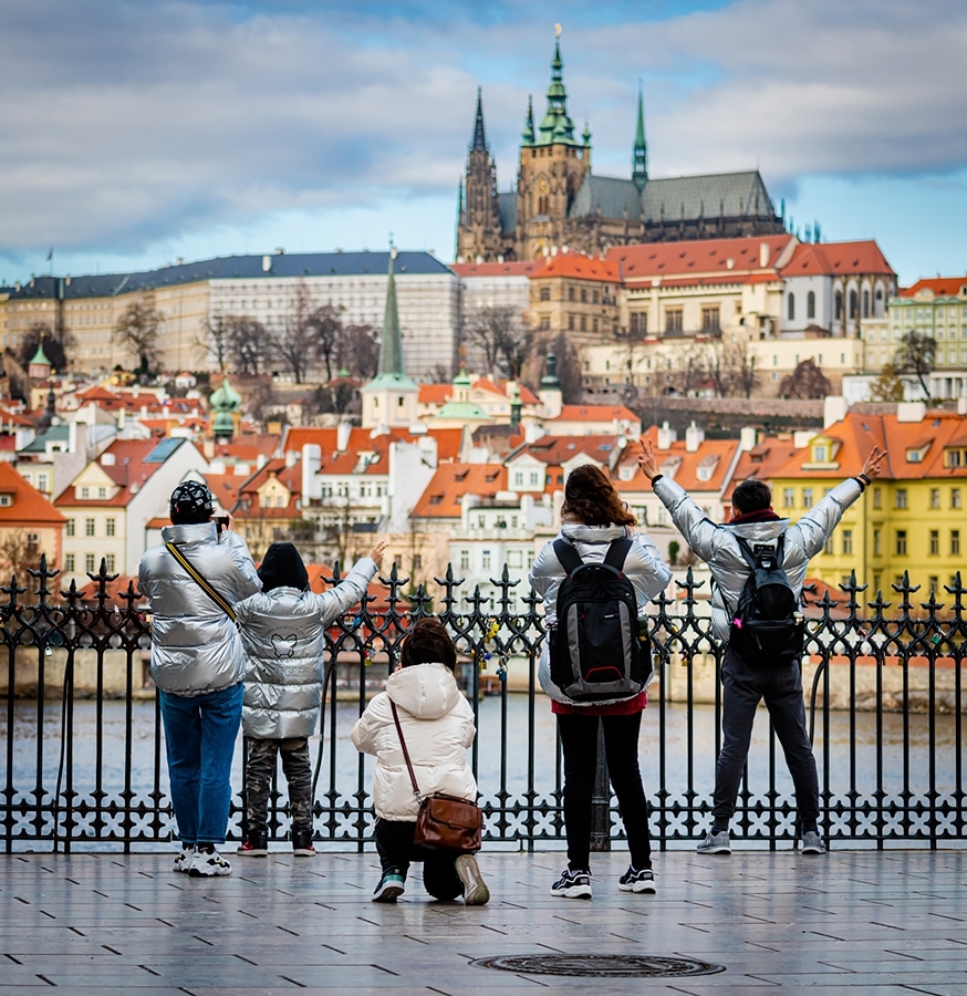 Family of tourists looking towards Prague Castle Prague, Czech Republic