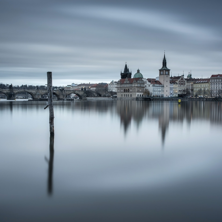 Vltava reflections of Charles Bridge and Novotného lávka Prague, Czech Republic