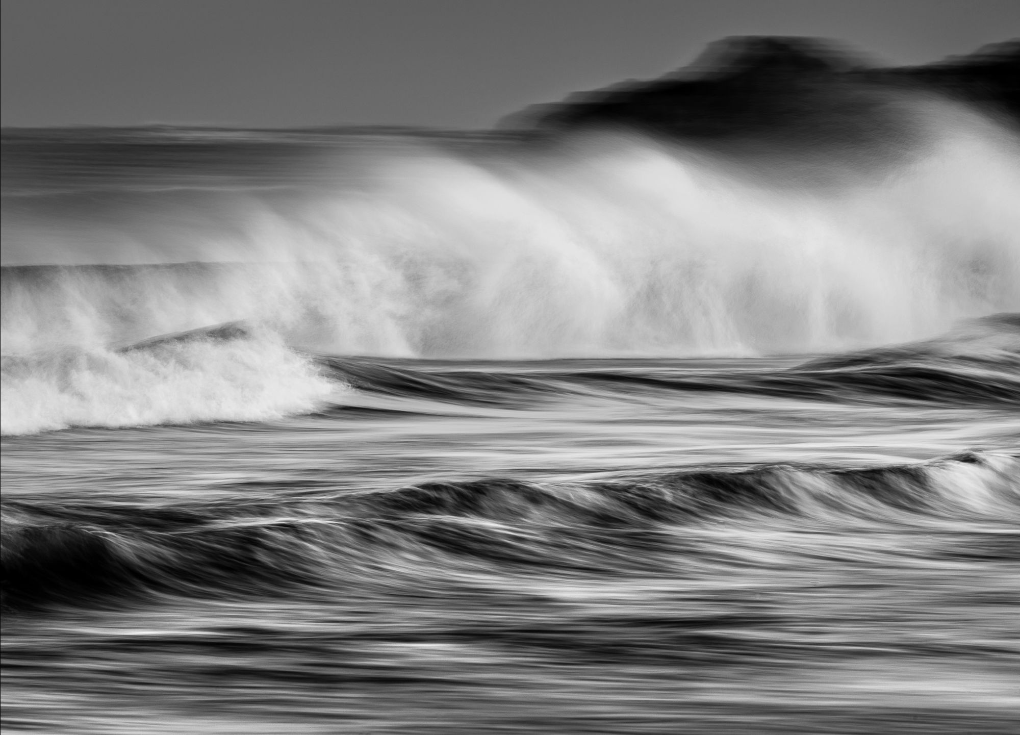 Black and white of waves on Stokksnes beach, Iceland. 