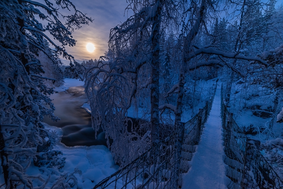 Footbridge and rising moon Kuusamo, Finland